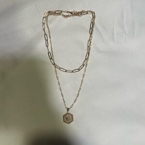 Gold amazon “M” necklace